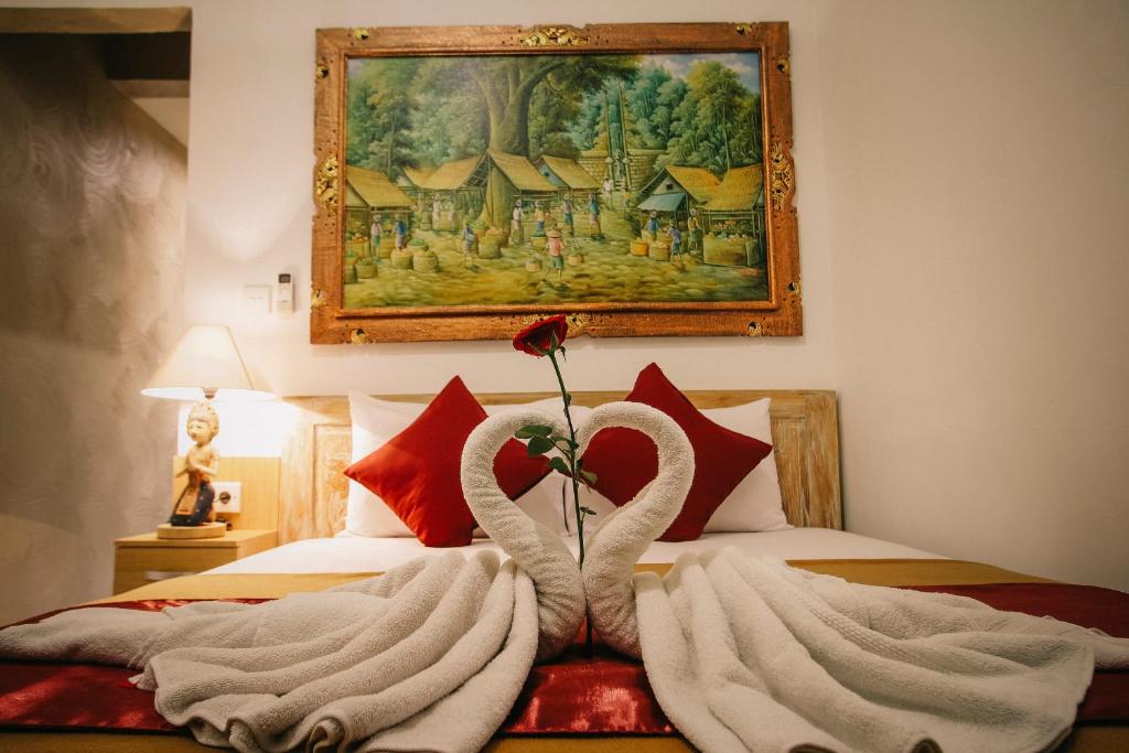 Postel nebo postele na pokoji v ubytování D'Ubud House