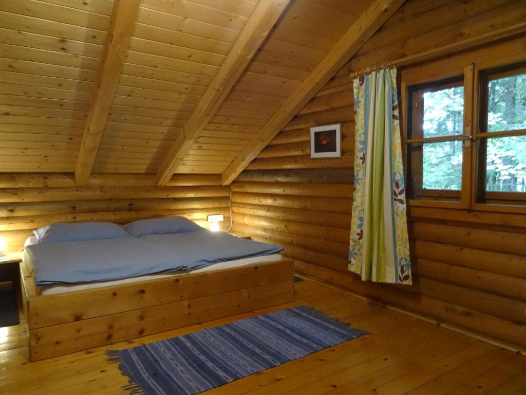 Postel nebo postele na pokoji v ubytování Ferienhütte Hochalm