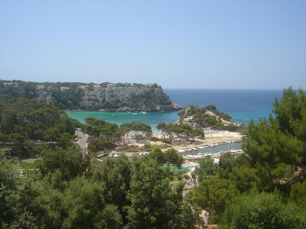 a view of a beach and the ocean at Menorca Bonavista in Cala Galdana