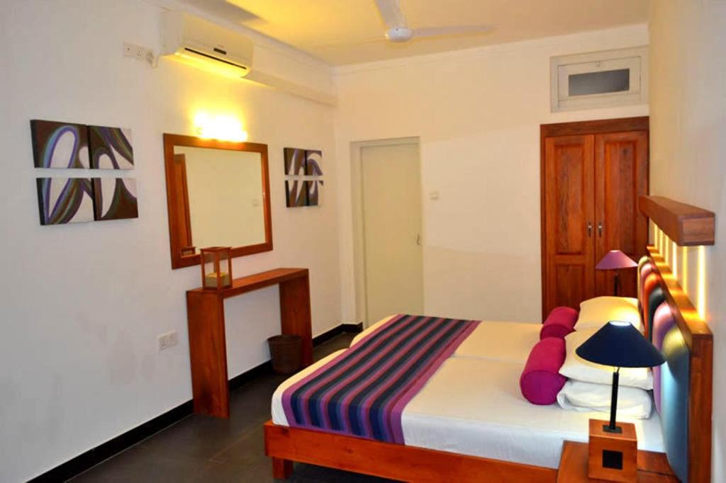 Postel nebo postele na pokoji v ubytování Star Beach Guest House