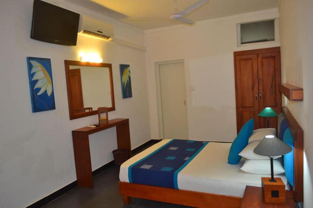 Postel nebo postele na pokoji v ubytování Star Beach Guest House