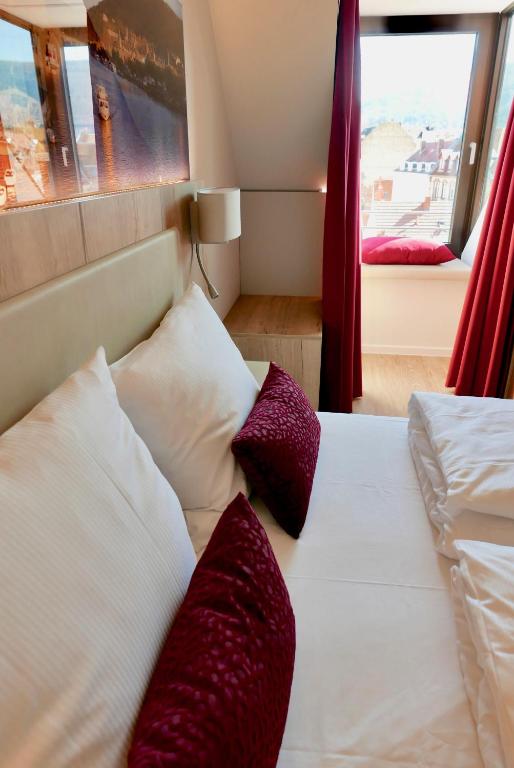 Postel nebo postele na pokoji v ubytování Rafaela Hotel Heidelberg