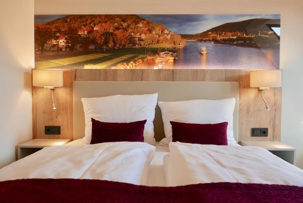 Postel nebo postele na pokoji v ubytování Rafaela Hotel Heidelberg