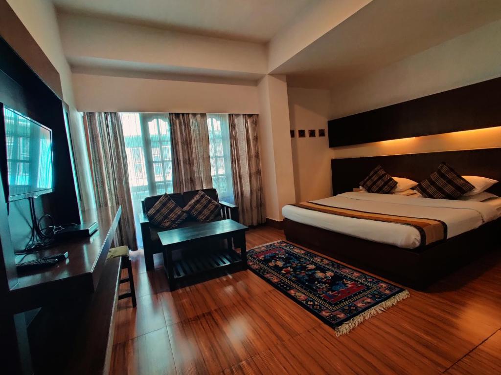 Rúm í herbergi á Hotel Tarayana