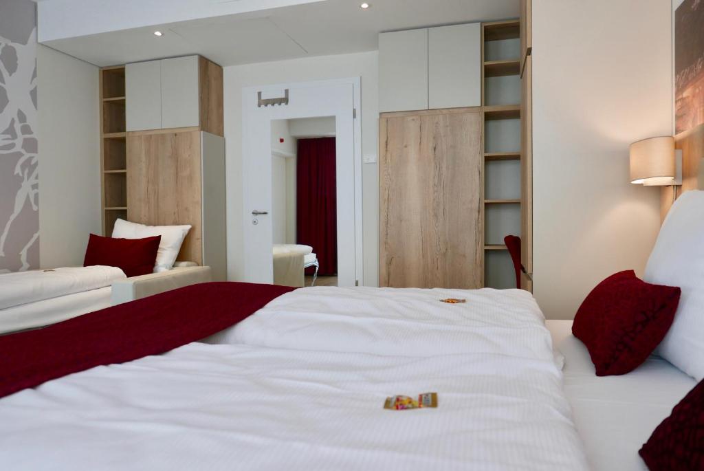 Postel nebo postele na pokoji v ubytování Rafaela Hotel Heidelberg