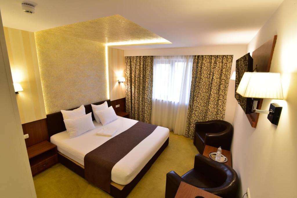 Postel nebo postele na pokoji v ubytování Hotel Forum