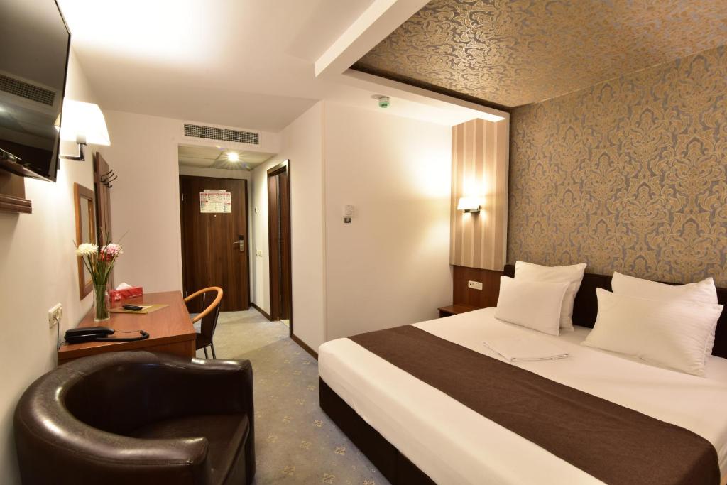 Postel nebo postele na pokoji v ubytování Hotel Forum