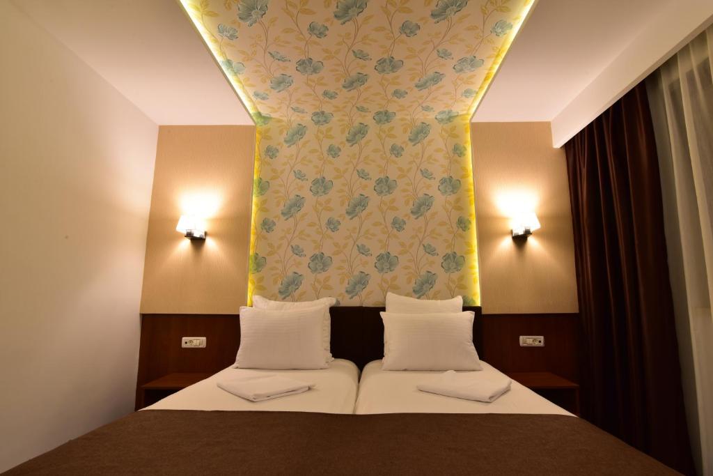 Postel nebo postele na pokoji v ubytování Hotel Forum