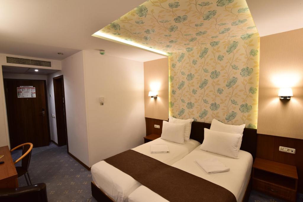 Postel nebo postele na pokoji v ubytování Hotel Forum