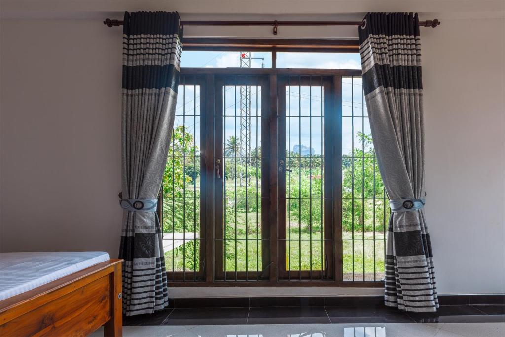 Postel nebo postele na pokoji v ubytování Gold Crown Residence