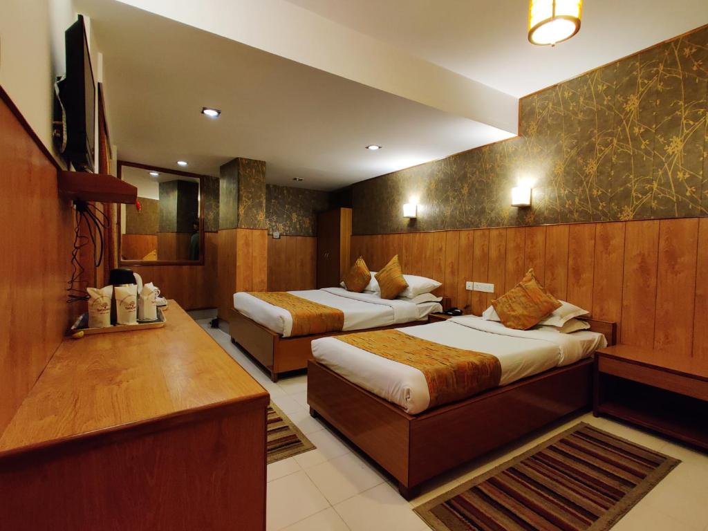 Rúm í herbergi á Hotel Tarayana