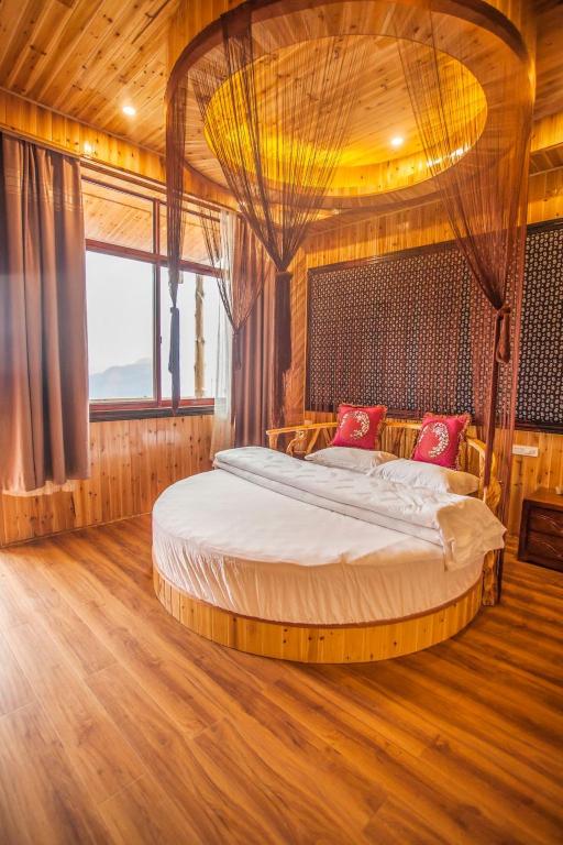 Postel nebo postele na pokoji v ubytování Long An Hotel 龙胜龙安酒店