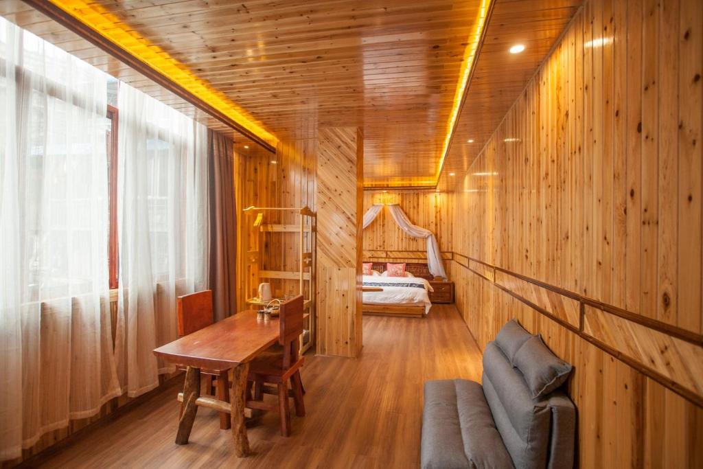 Postel nebo postele na pokoji v ubytování Long An Hotel 龙胜龙安酒店