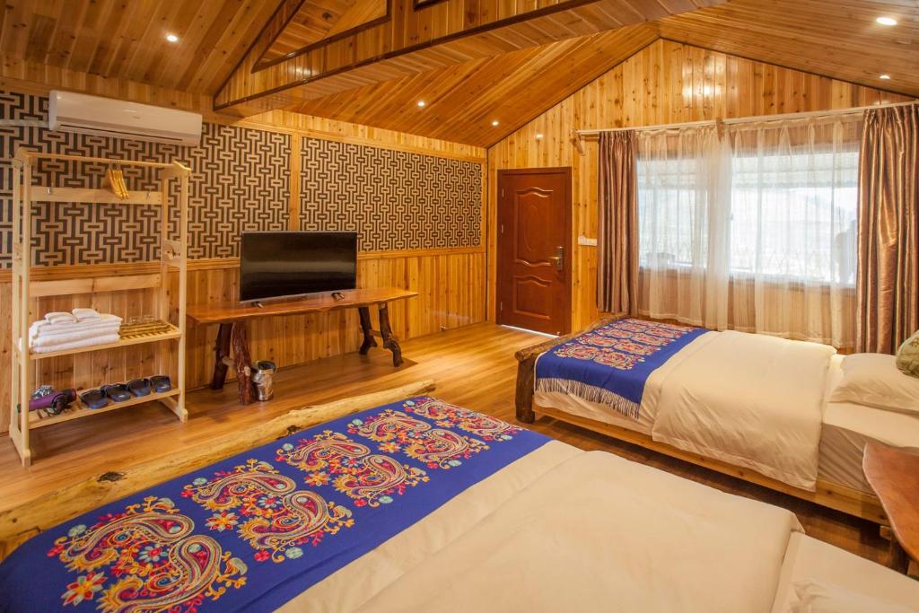 Postel nebo postele na pokoji v ubytování Long An Hotel 龙胜龙安酒店