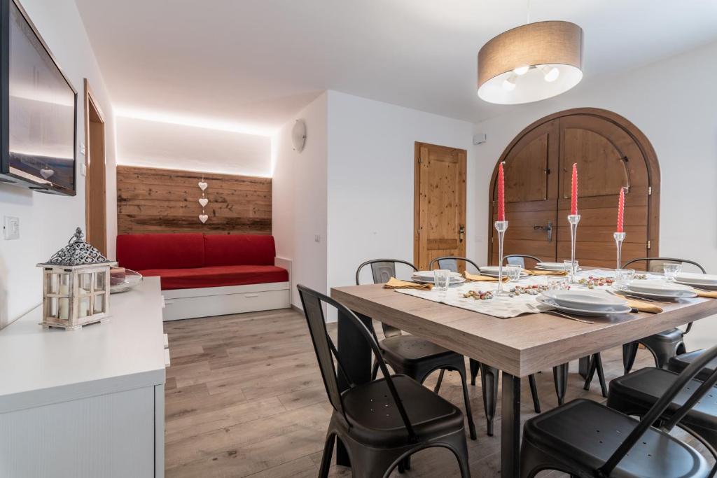 Televízia a/alebo spoločenská miestnosť v ubytovaní Residence Arnica