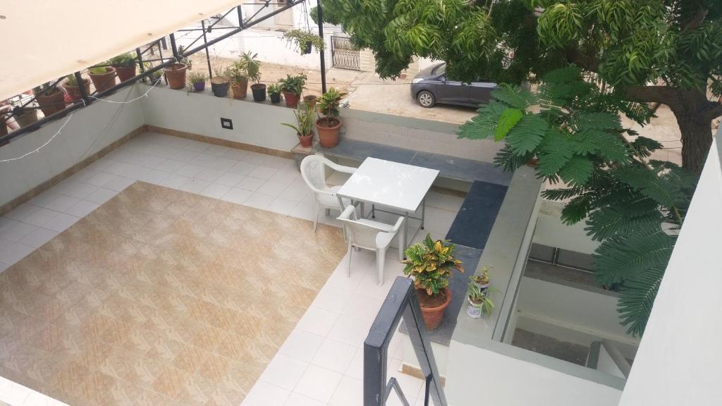 an overhead view of a patio with a table and chairs at ''Go Desert'' Homestay in Bhuj