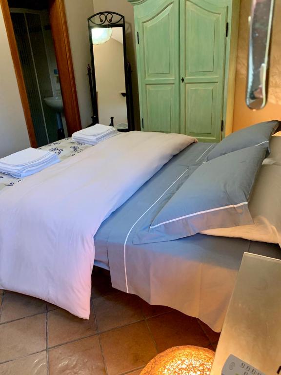 Postel nebo postele na pokoji v ubytování Casa le valli