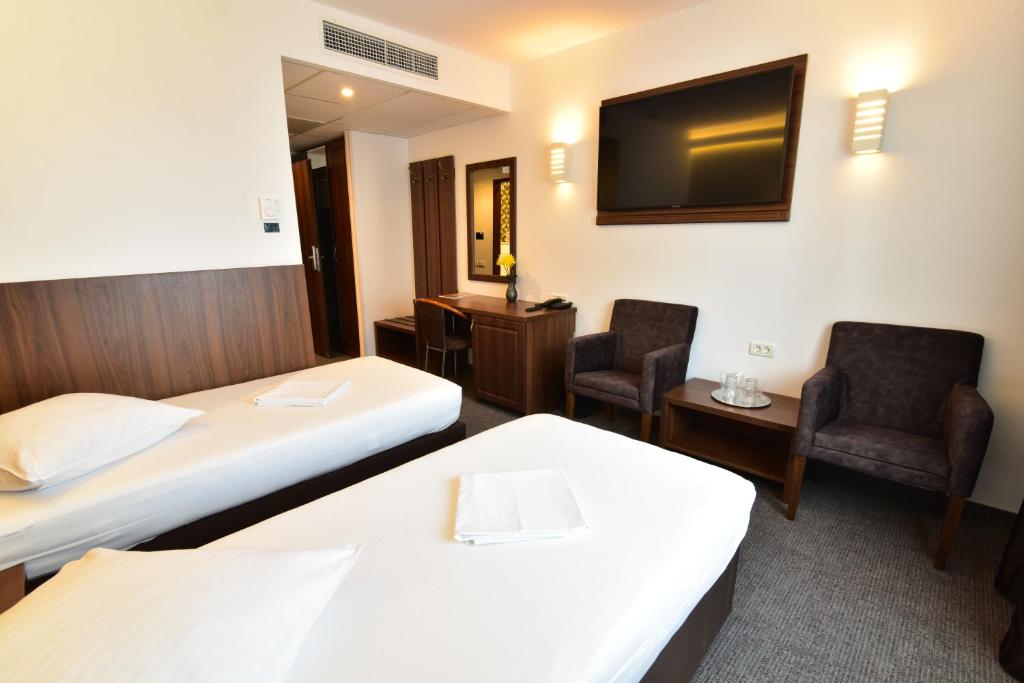Postel nebo postele na pokoji v ubytování Hotel Forum