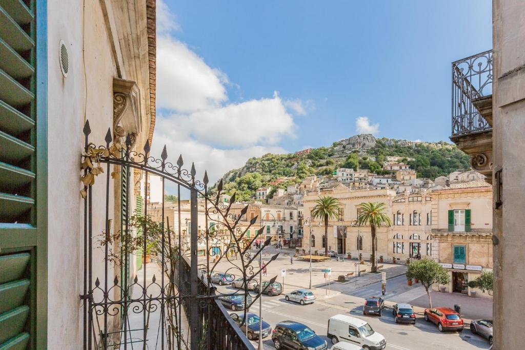 a view from a balcony of a city with a mountain at Modica for Family - Rooms and Apartments in Modica