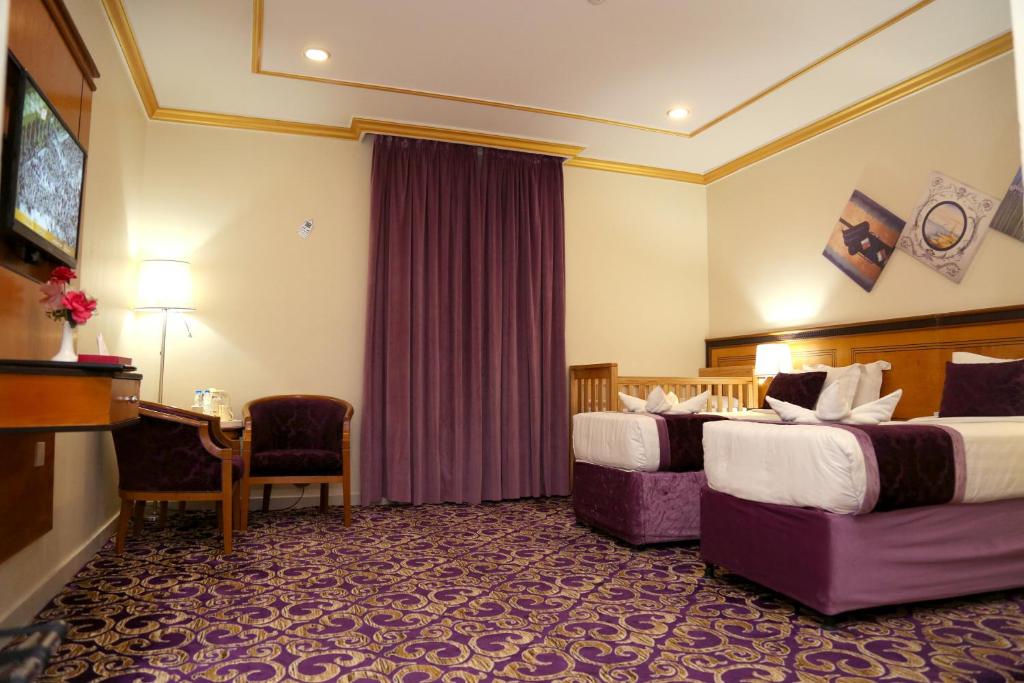 TV a/nebo společenská místnost v ubytování Amjad Al Deafah Hotel