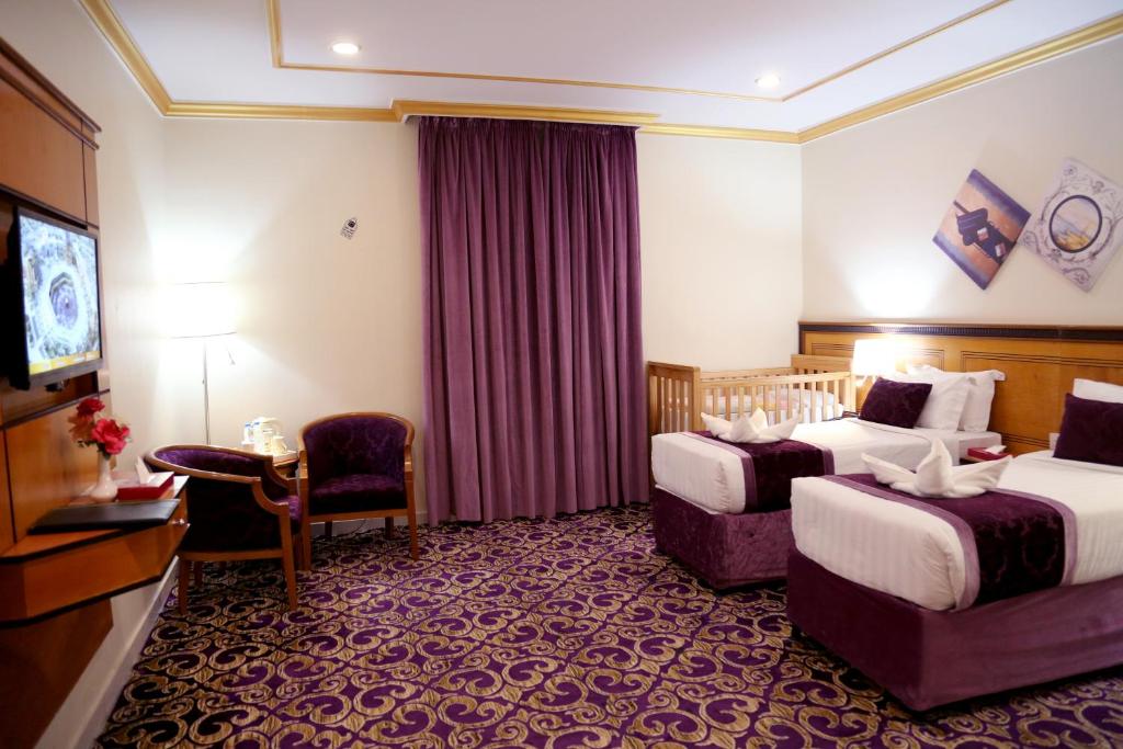 Postel nebo postele na pokoji v ubytování Amjad Al Deafah Hotel