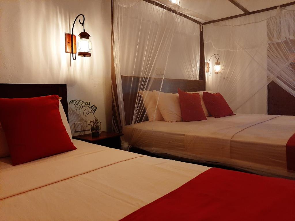 Postel nebo postele na pokoji v ubytování Weligama Ocean Breeze