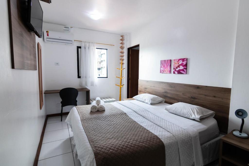 
A bed or beds in a room at Hotel Gogó da Ema
