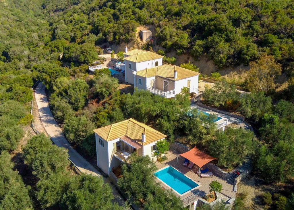 an aerial view of a house with a swimming pool at Kosyforema Villas in Gialova