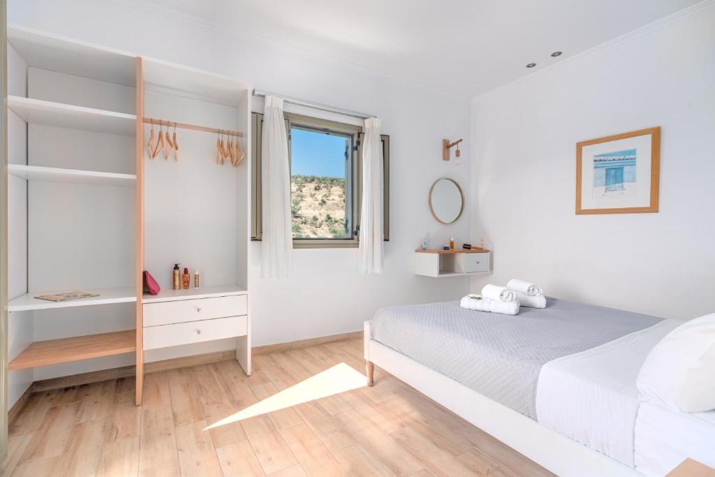 Posteľ alebo postele v izbe v ubytovaní Kosyforema Villas