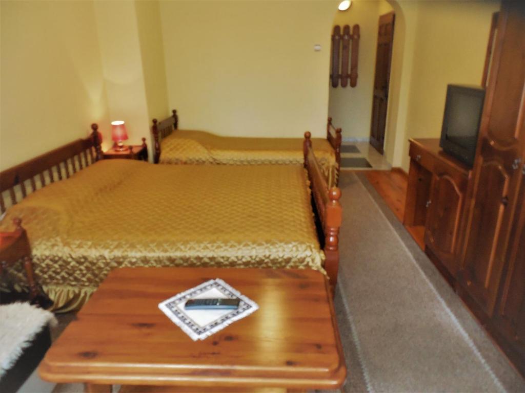 Postel nebo postele na pokoji v ubytování Boyadjiyski Guest House