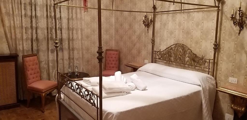 Postel nebo postele na pokoji v ubytování Casa Turística Plaza del Conde
