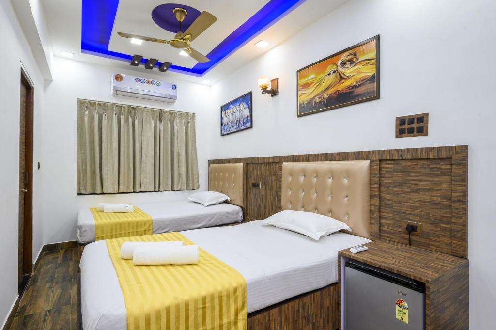 En eller flere senge i et værelse på Jia Calangute Goa