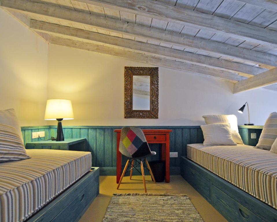 Postel nebo postele na pokoji v ubytování Apokryfo Traditional Guesthouse
