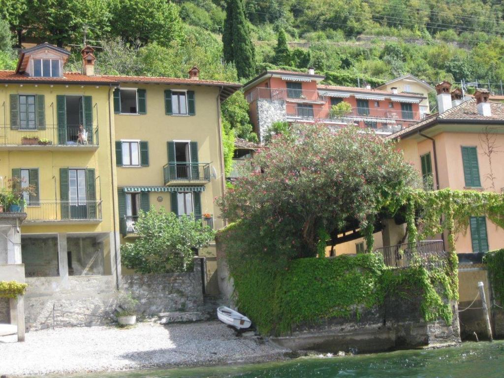 a group of houses next to the water at CASA IN RIVA AL LAGO in Varenna