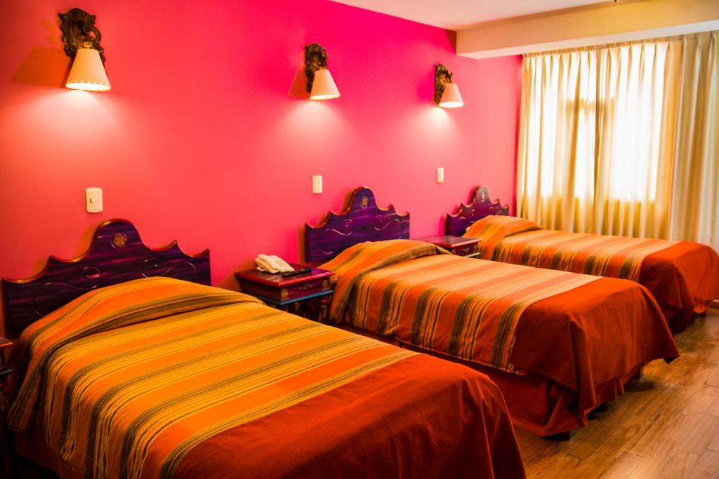 Postel nebo postele na pokoji v ubytování Hotel Warari