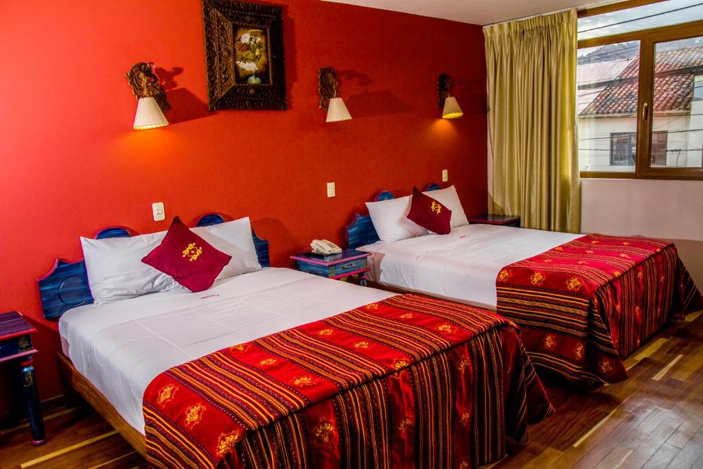 Hotel Warari tesisinde bir odada yatak veya yataklar