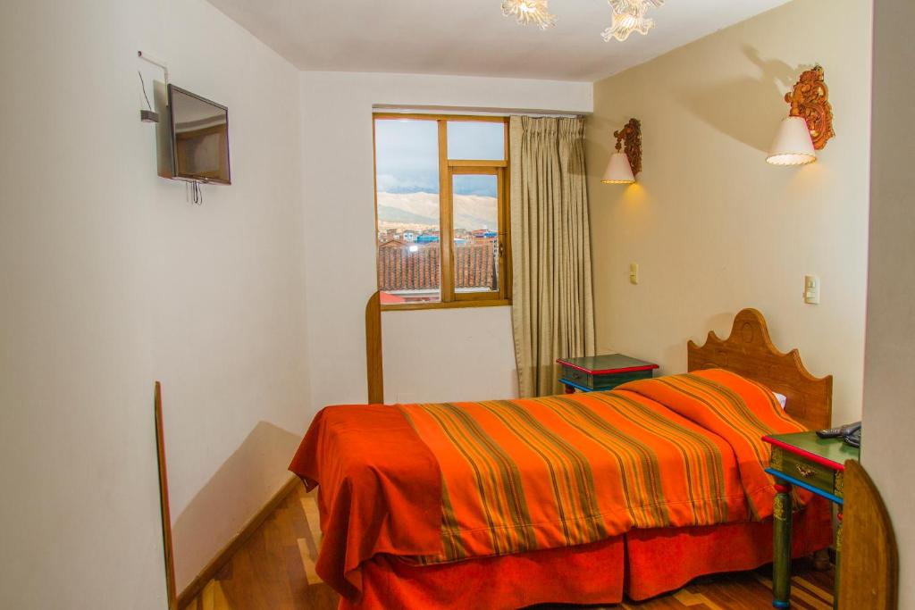 Postel nebo postele na pokoji v ubytování Hotel Warari