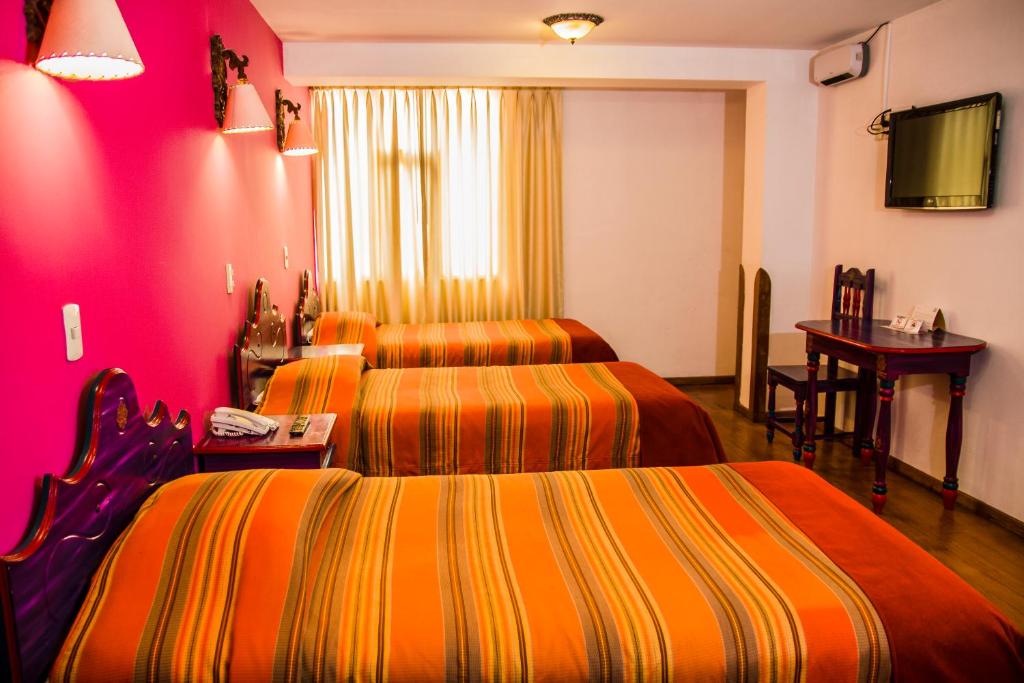 Postel nebo postele na pokoji v ubytování Hotel Warari