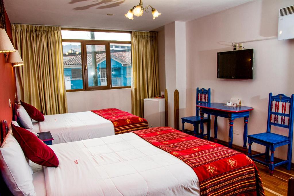 Postel nebo postele na pokoji v ubytování Hotel Warari