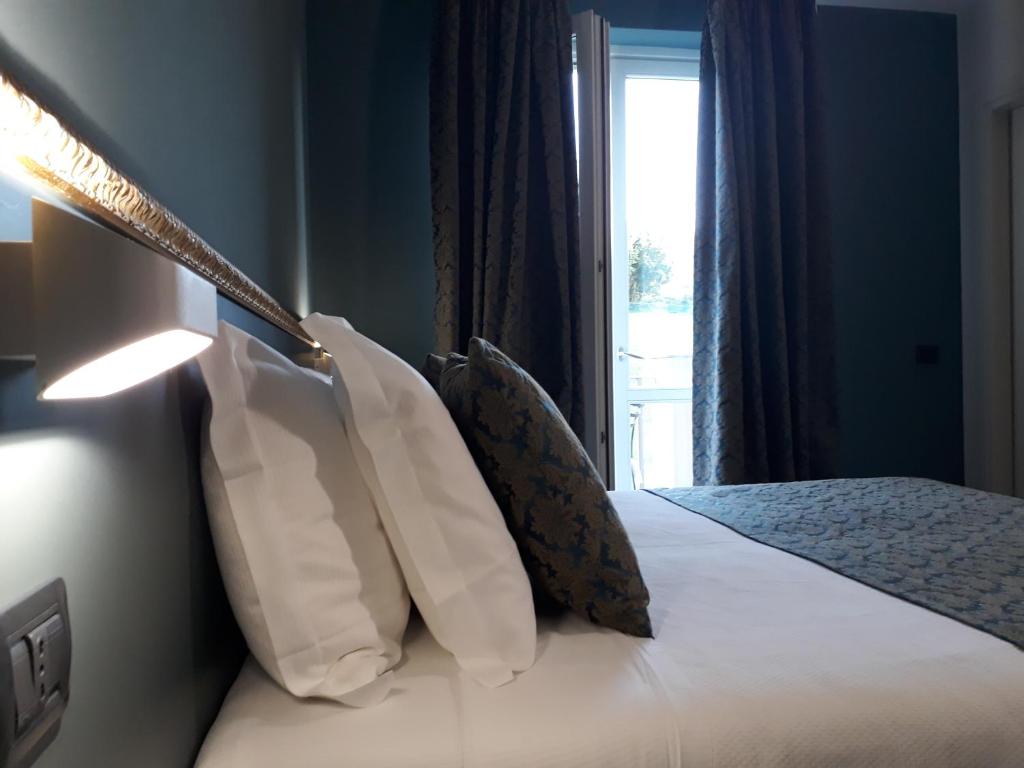 A bed or beds in a room at Resort Limax Acis