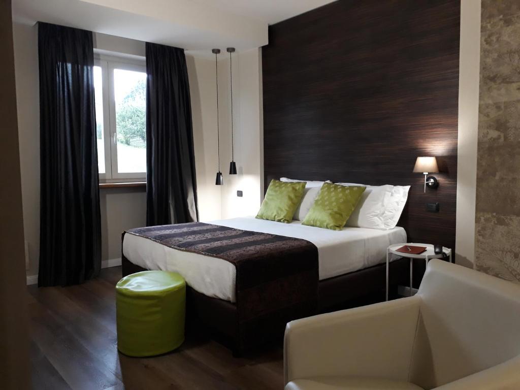 A bed or beds in a room at Resort Limax Acis