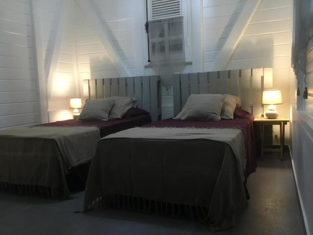 Postel nebo postele na pokoji v ubytování Villa Bwa Kannel