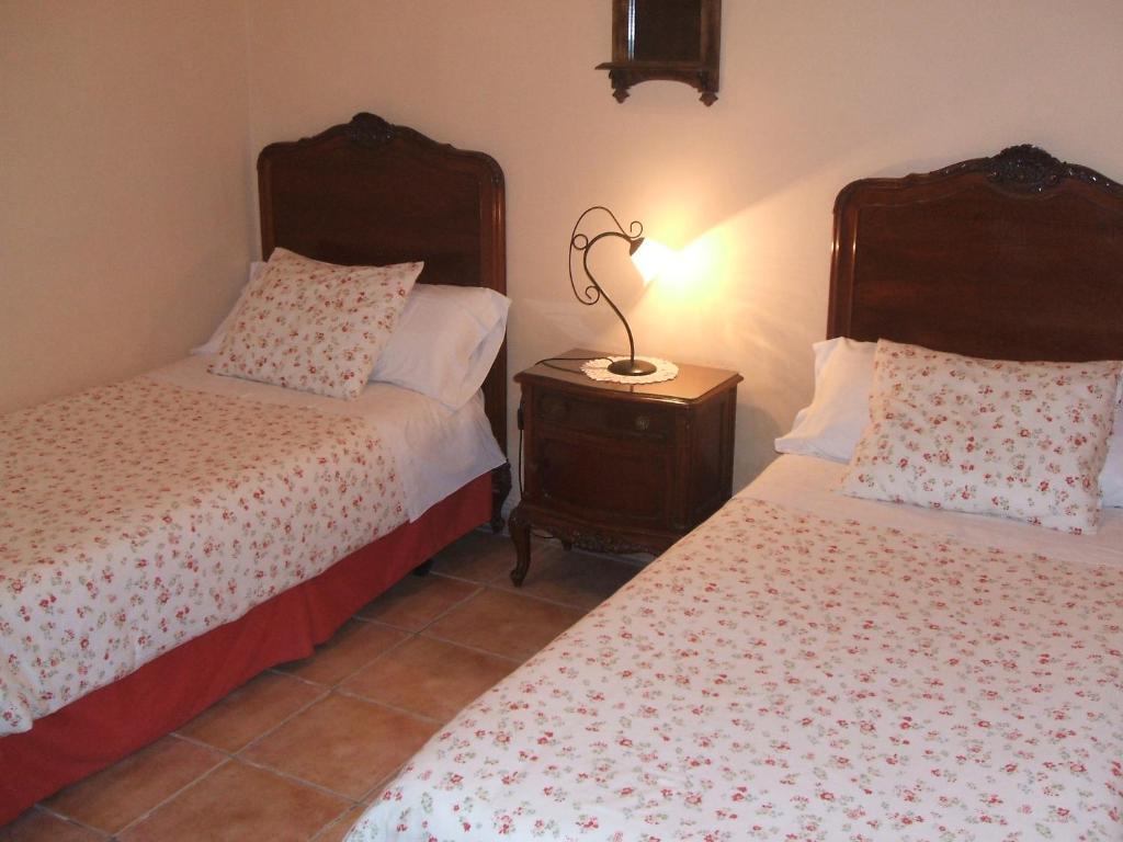 Cama o camas de una habitación en Apartamentos Rurales Fuente de Marzo