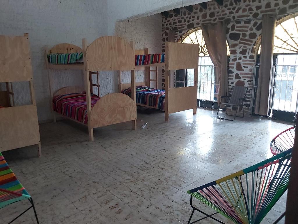 Postel nebo postele na pokoji v ubytování El Sunset Hostel