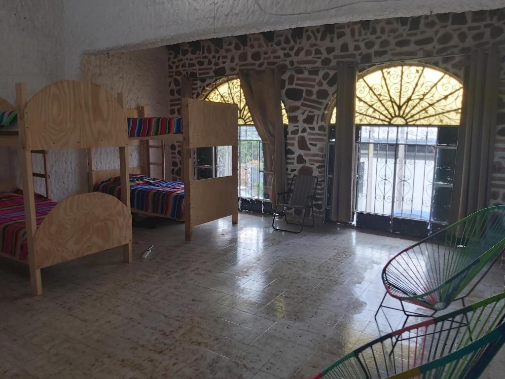 Postel nebo postele na pokoji v ubytování El Sunset Hostel