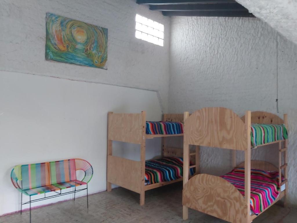 Postel nebo postele na pokoji v ubytování El Sunset Hostel