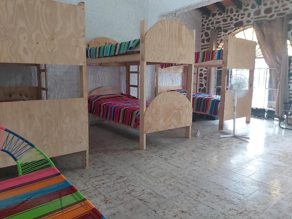 Postel nebo postele na pokoji v ubytování El Sunset Hostel