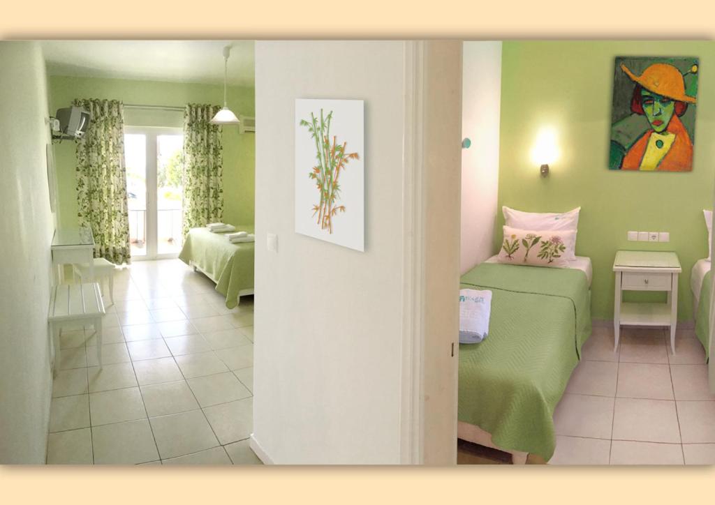 Кровать или кровати в номере Haris Hotel Apartments and Suites
