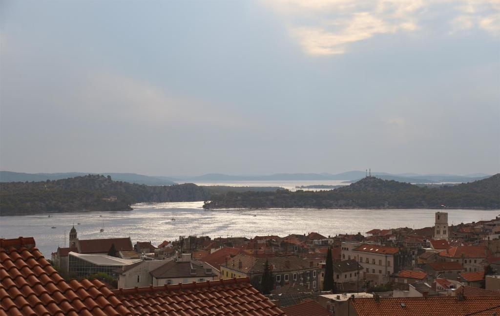 a view of a city with a river and buildings at Apartmani Šarić in Šibenik
