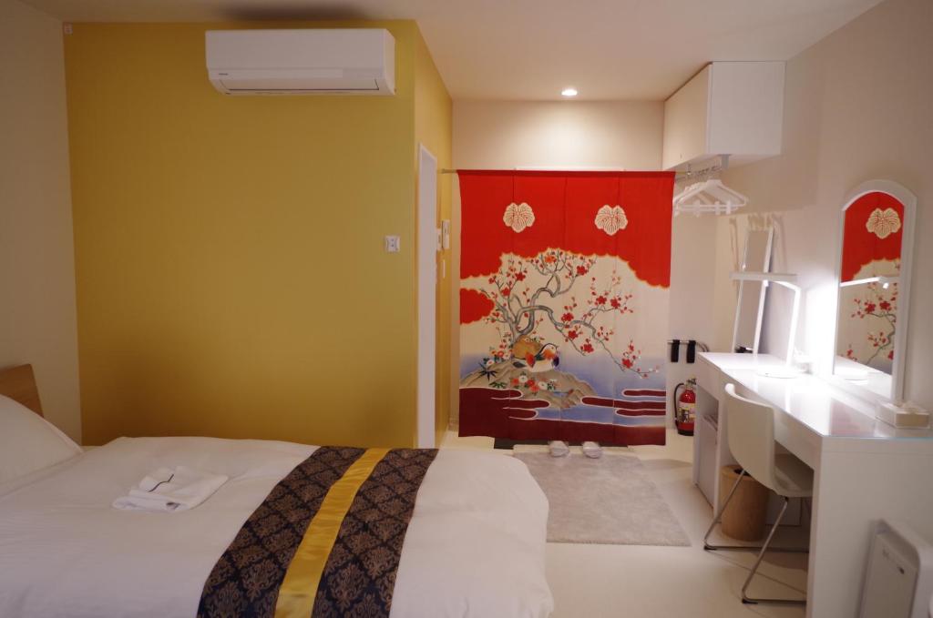 Posteľ alebo postele v izbe v ubytovaní 金沢イン